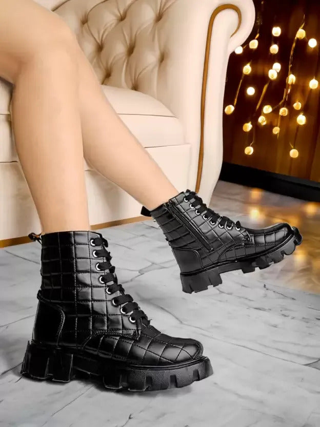 women's combat boots featuring a quilted upper texture and a thick lug sole
 Black