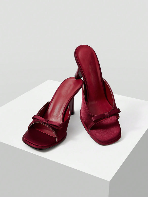 JM Looks heeled mules featuring a small bow detail on the vamp and a sculpted heel Cherry