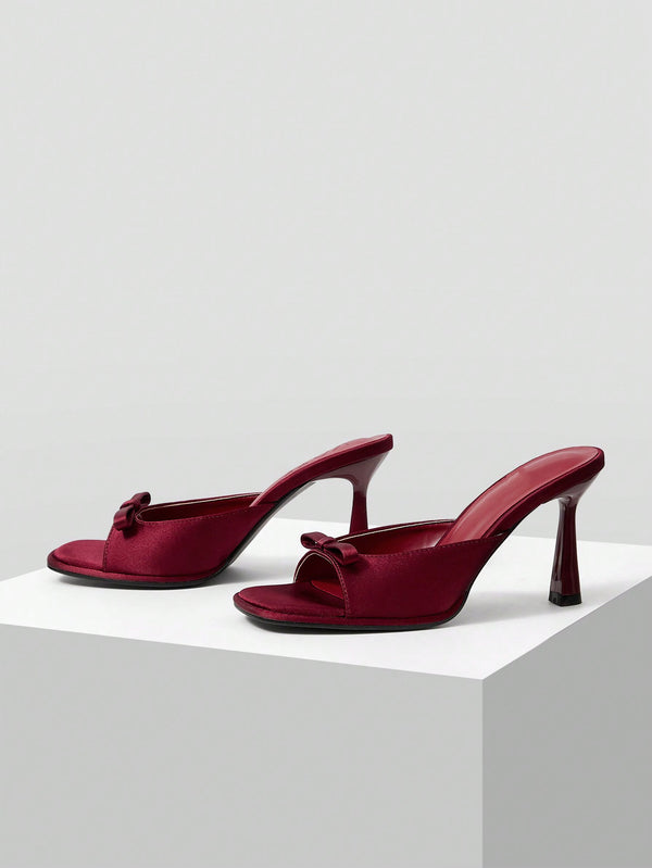JM Looks heeled mules featuring a small bow detail on the vamp and a sculpted heel Cherry