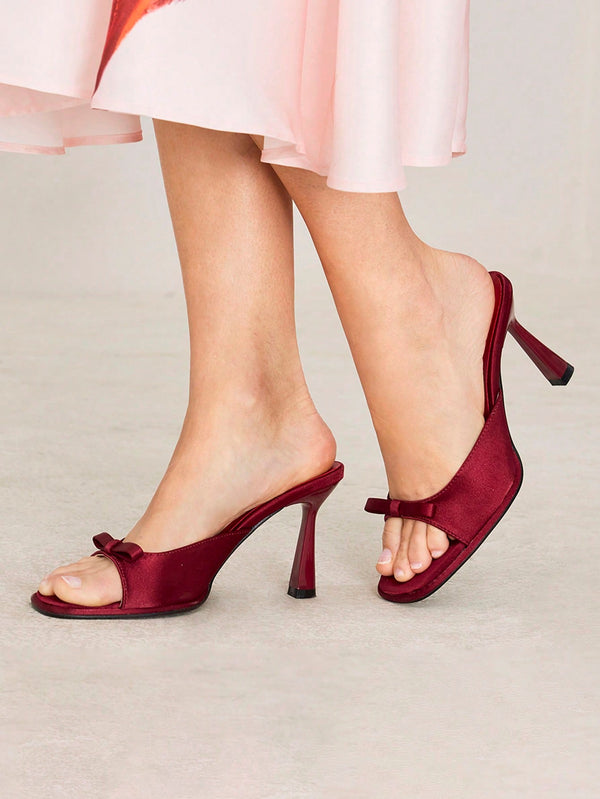 JM Looks heeled mules featuring a small bow detail on the vamp and a sculpted heel Cherry