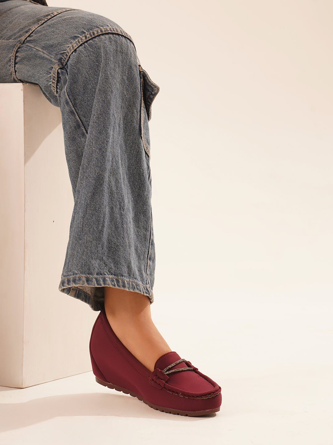 loafers with a subtle wedge heel and an embellished buckle detail on the vamp
 Cherry