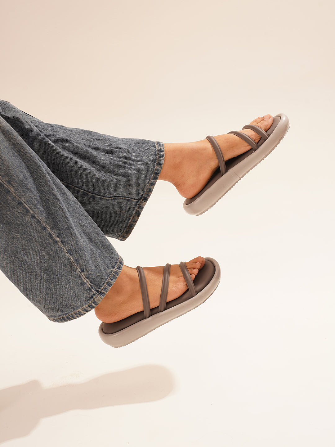 open-toe flat sandals with multiple slender straps across the forefoot
 Grey