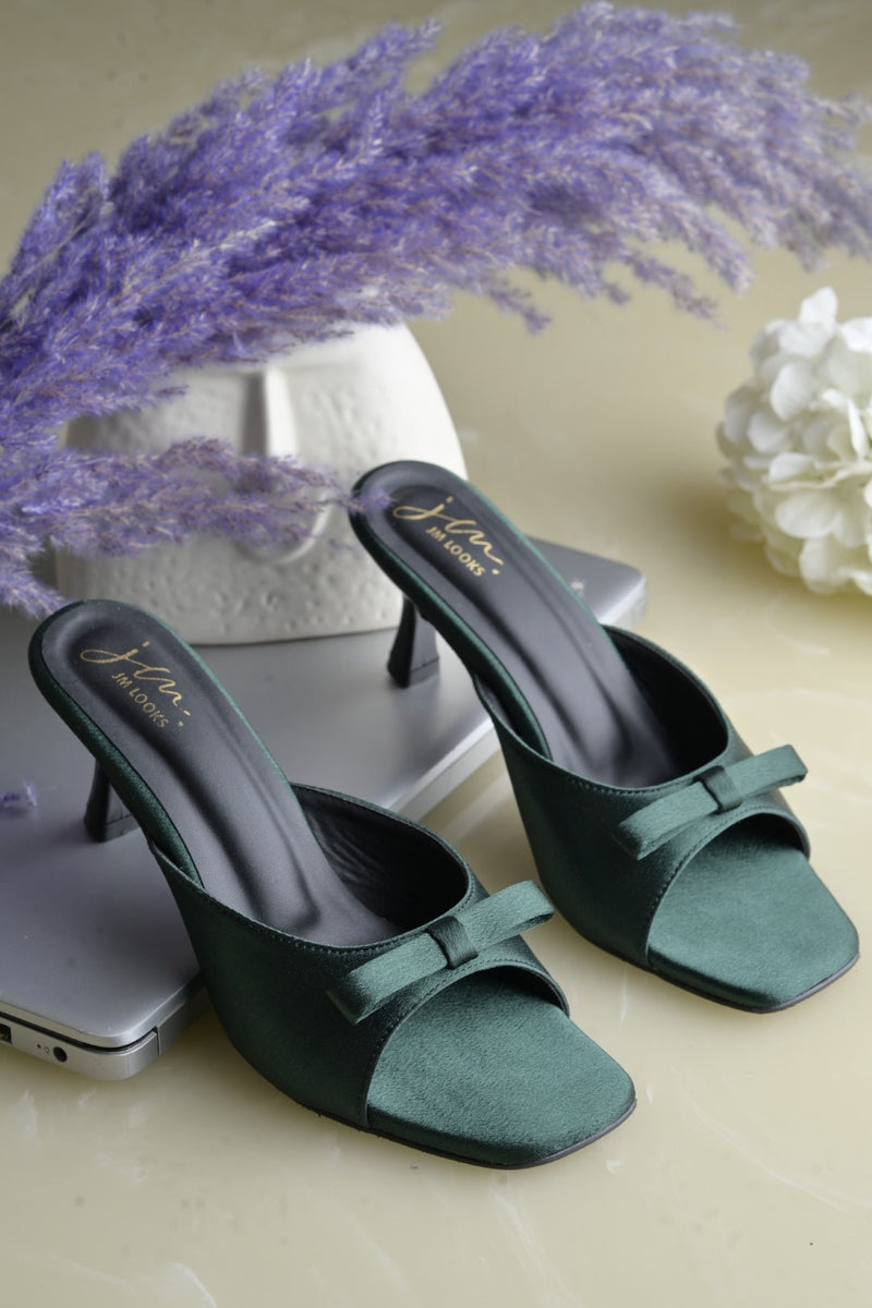 JM Looks heeled mules featuring a small bow detail on the vamp and a sculpted heel
 Green