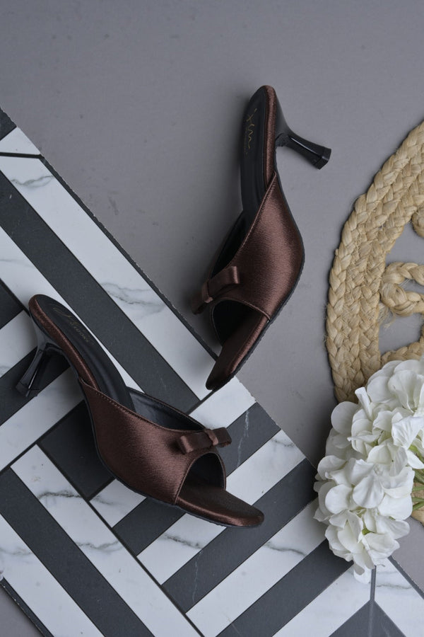 JM Looks heeled mules featuring a small bow detail on the vamp and a sculpted heel
 Copper
