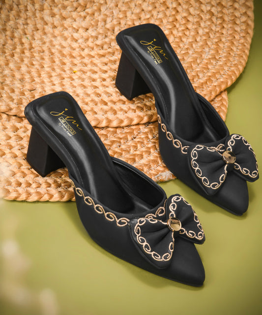 Women's pointed toe slip-on block heel mules with bow detail in Black