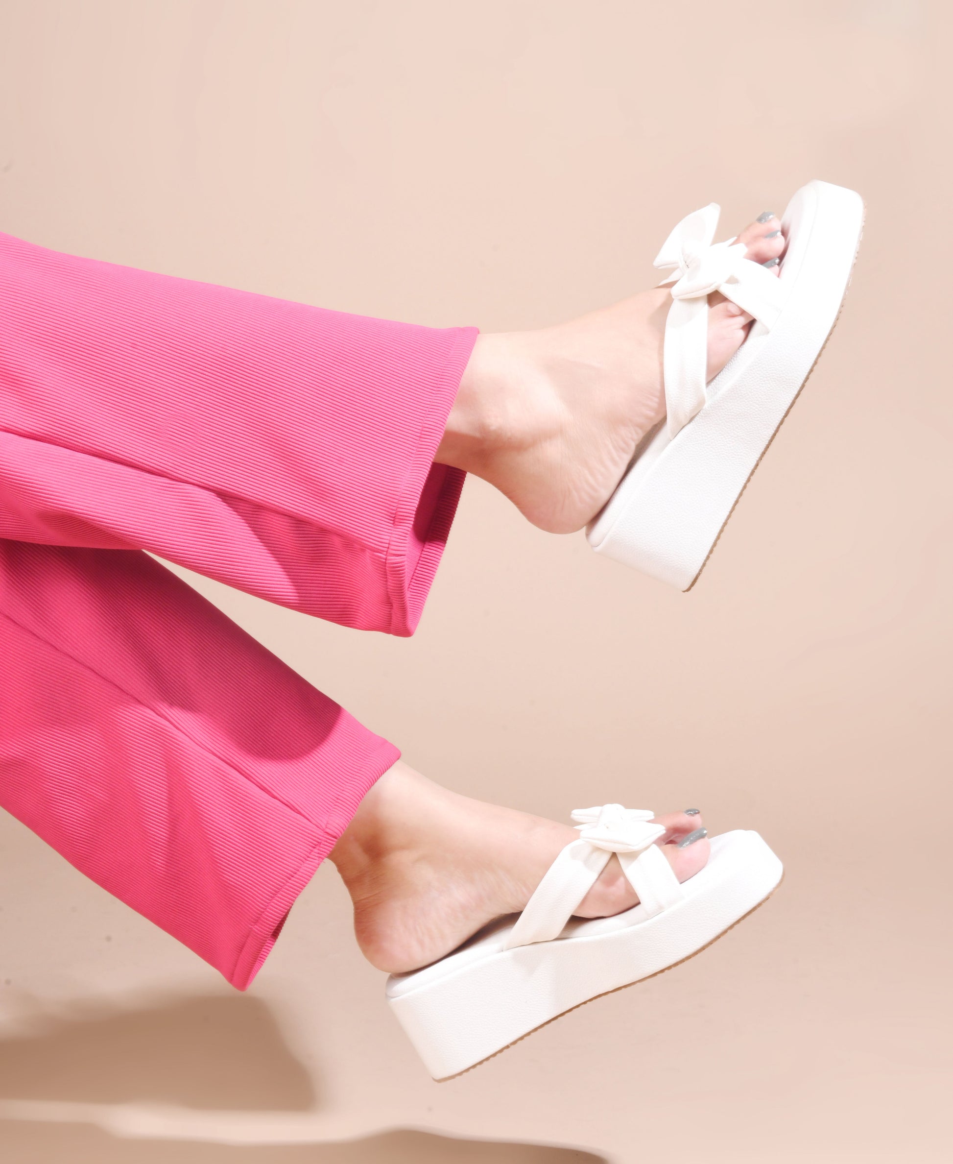 Jm Looks platform slides featuring a large, knotted bow on the strap
 White