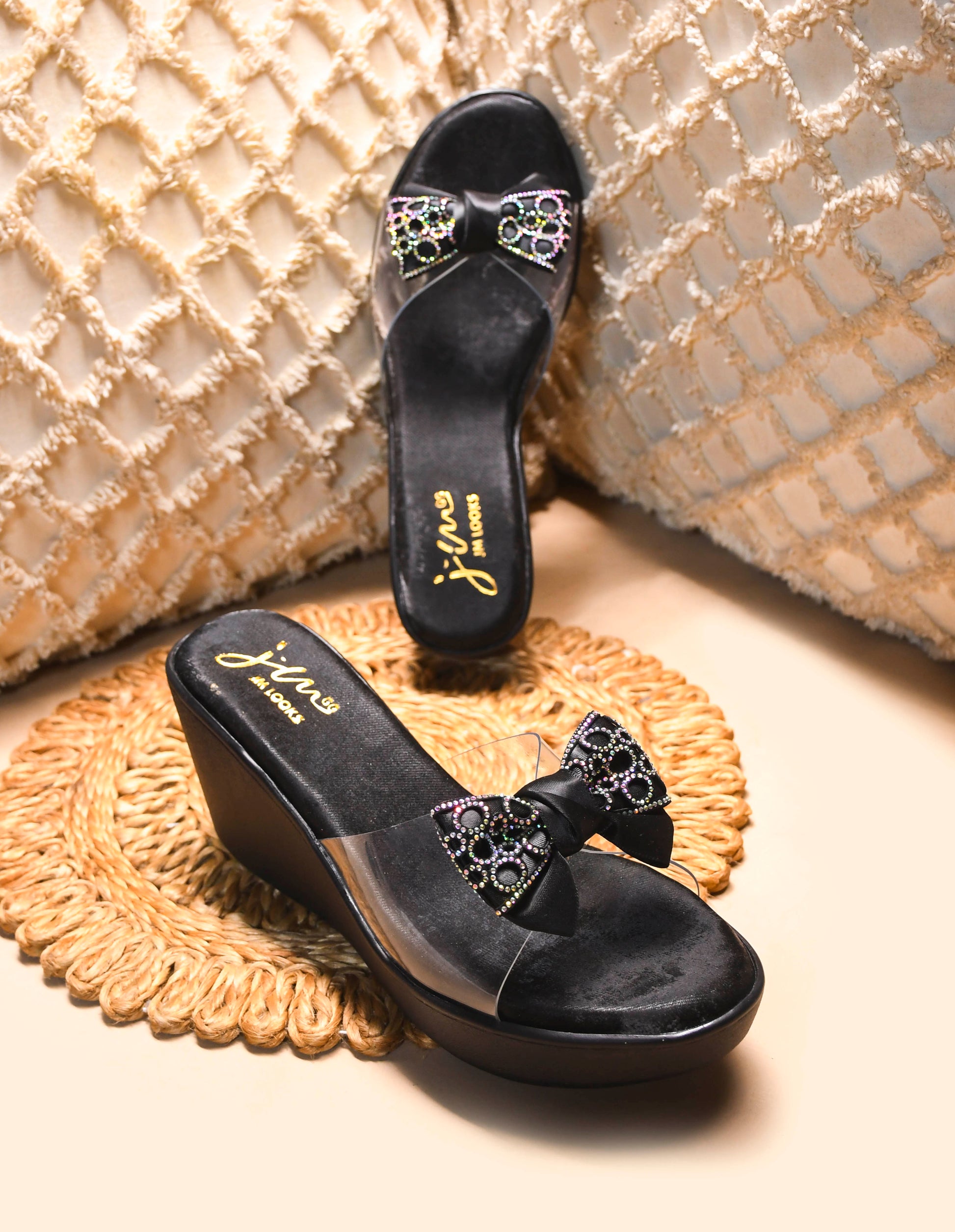 Jm Looks embellished bow wedge platform sandals, with one being worn
 Black