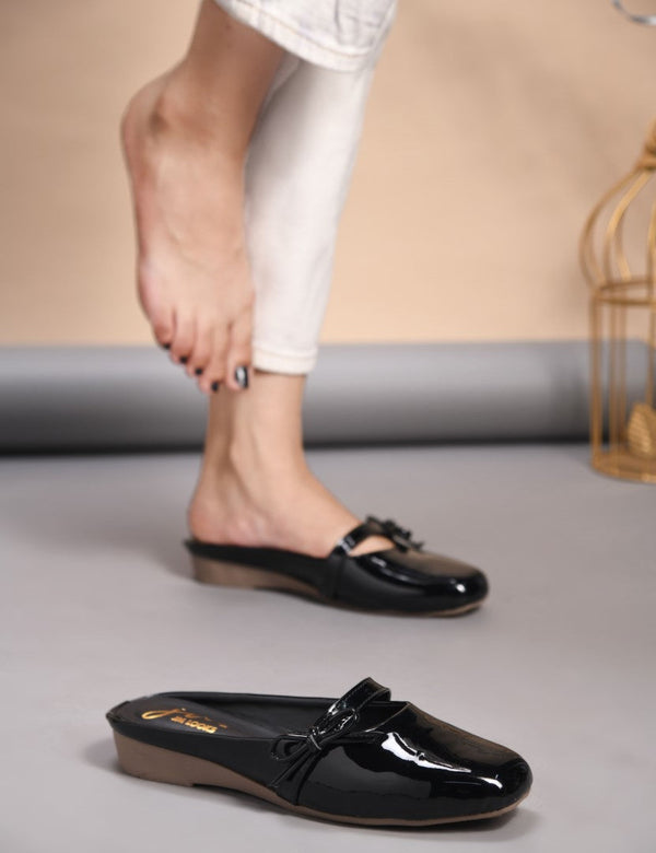 Women's black patent slip-on mules with bow detail