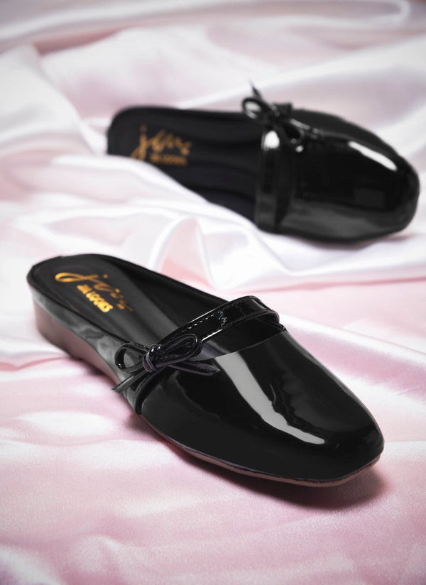 Women's balck patent slip-on mules with bow detail