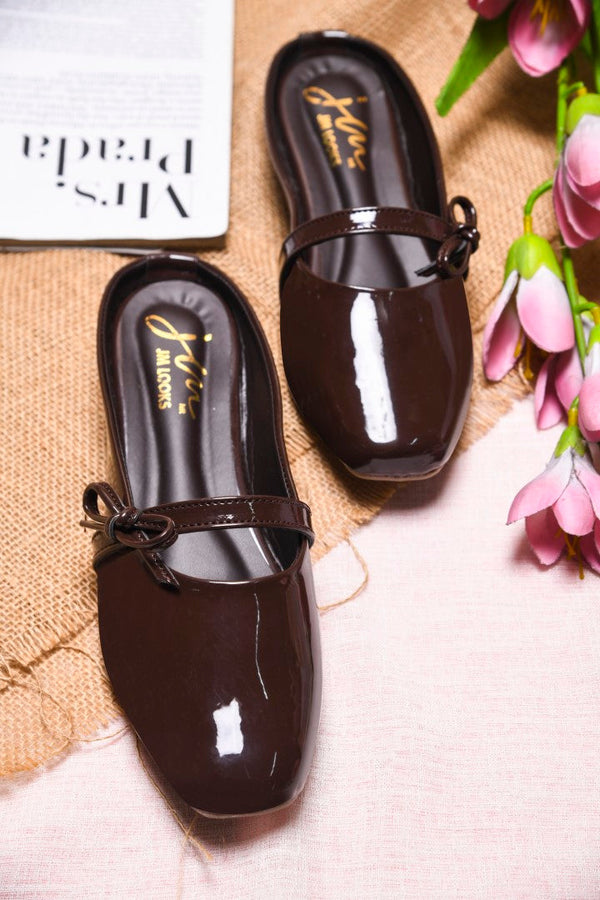 Women's brown patent slip-on mules with bow detail