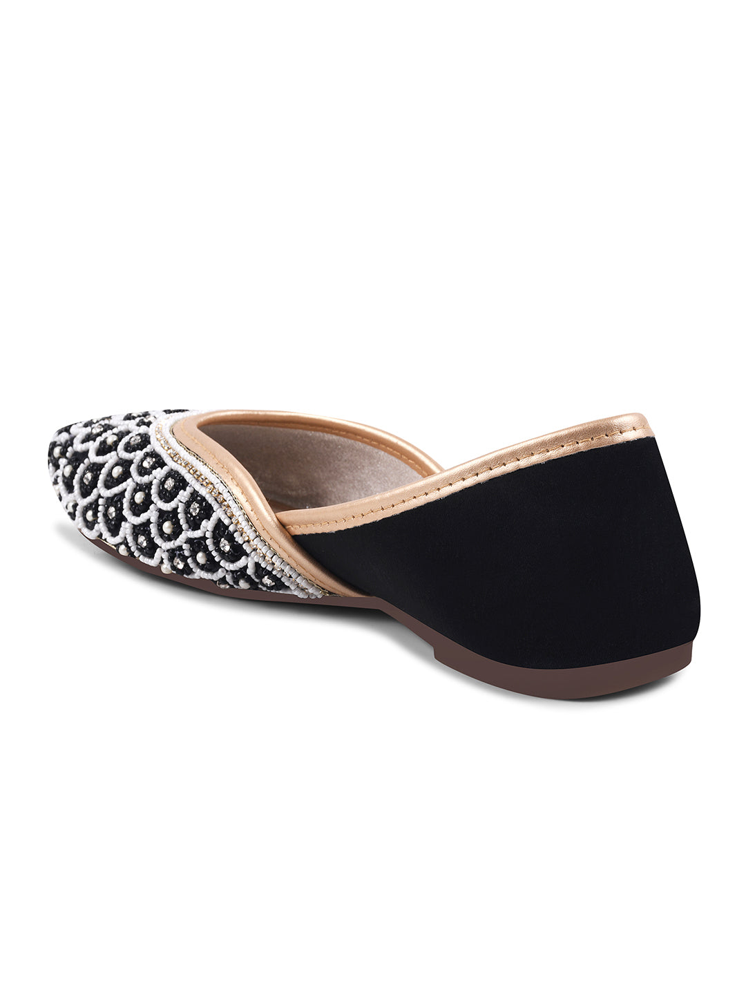 exquisitely embellished juttis featuring a detailed petal design
 Black