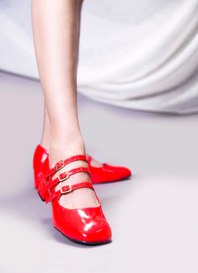 Mary Jane shoe with three straps and buckle closures
 Red