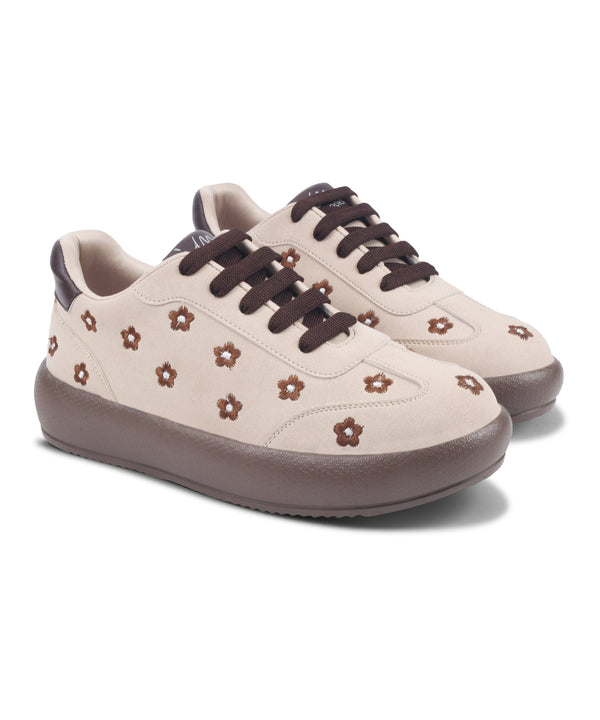Cream suede sneakers for women with embroidered flowers, lace-up front and platform sole