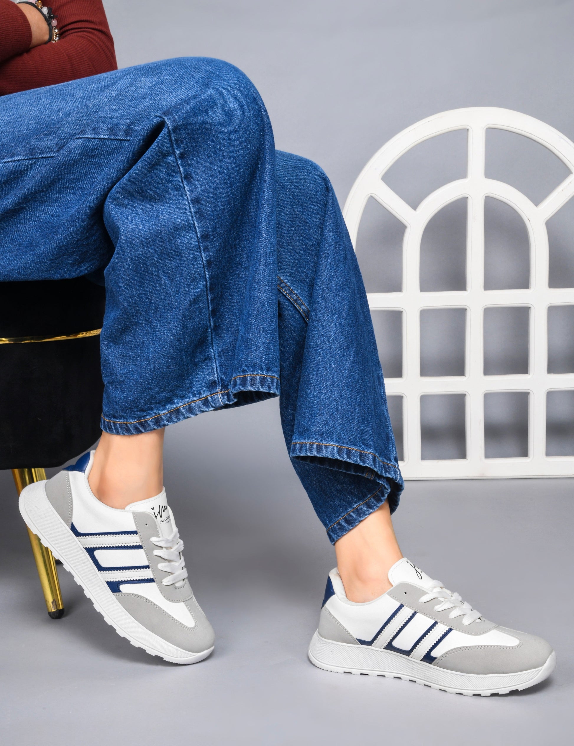 Women's lace-up casual sneakers in grey white with blue stripe detailing on cushioned white platform sole