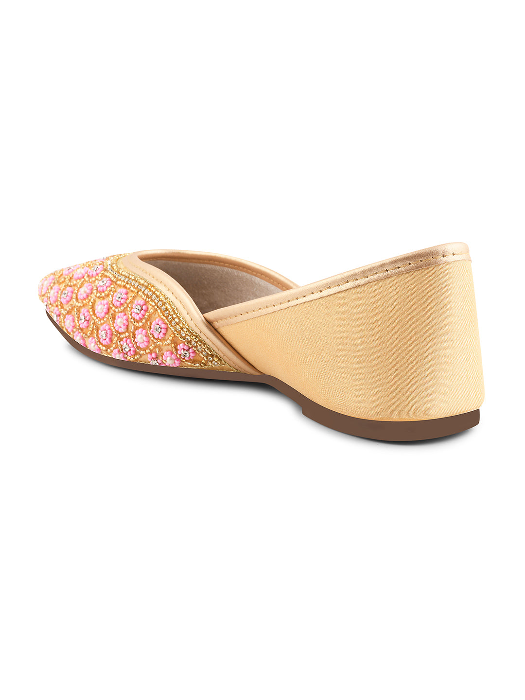 exquisitely embellished juttis featuring a detailed petal design
 Golden