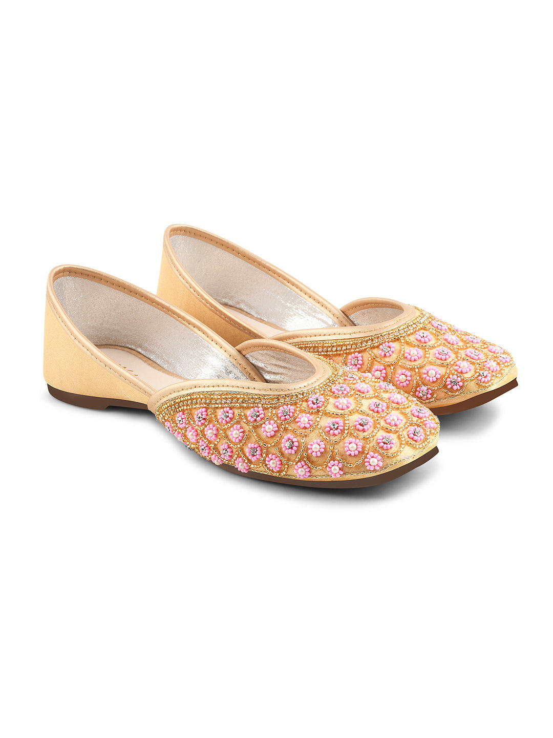 exquisitely embellished juttis featuring a detailed petal design
 Golden