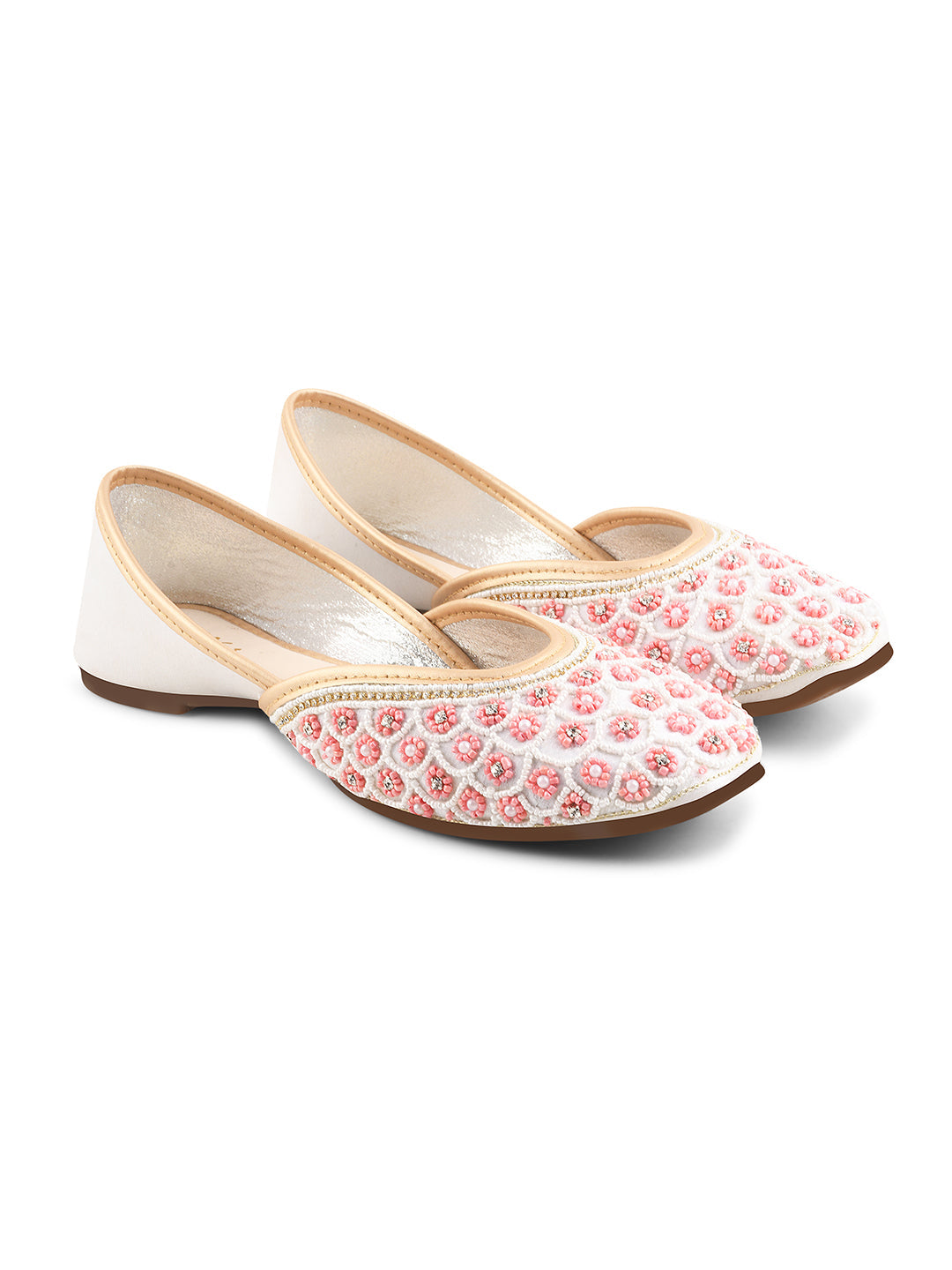 exquisitely embellished juttis featuring a detailed petal design
 White