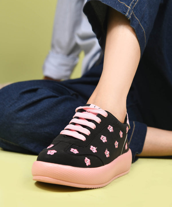 Black suede sneakers for women with embroidered flowers, lace-up front and platform sole