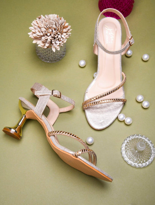 embellished strappy stiletto sandals with a unique heel design
 Golden