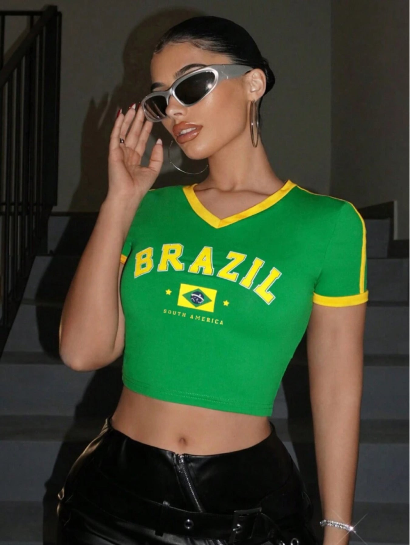 Green Brasil printed crop top with yellow ribbed trims, side stripes, flag graphic, and short sleeves