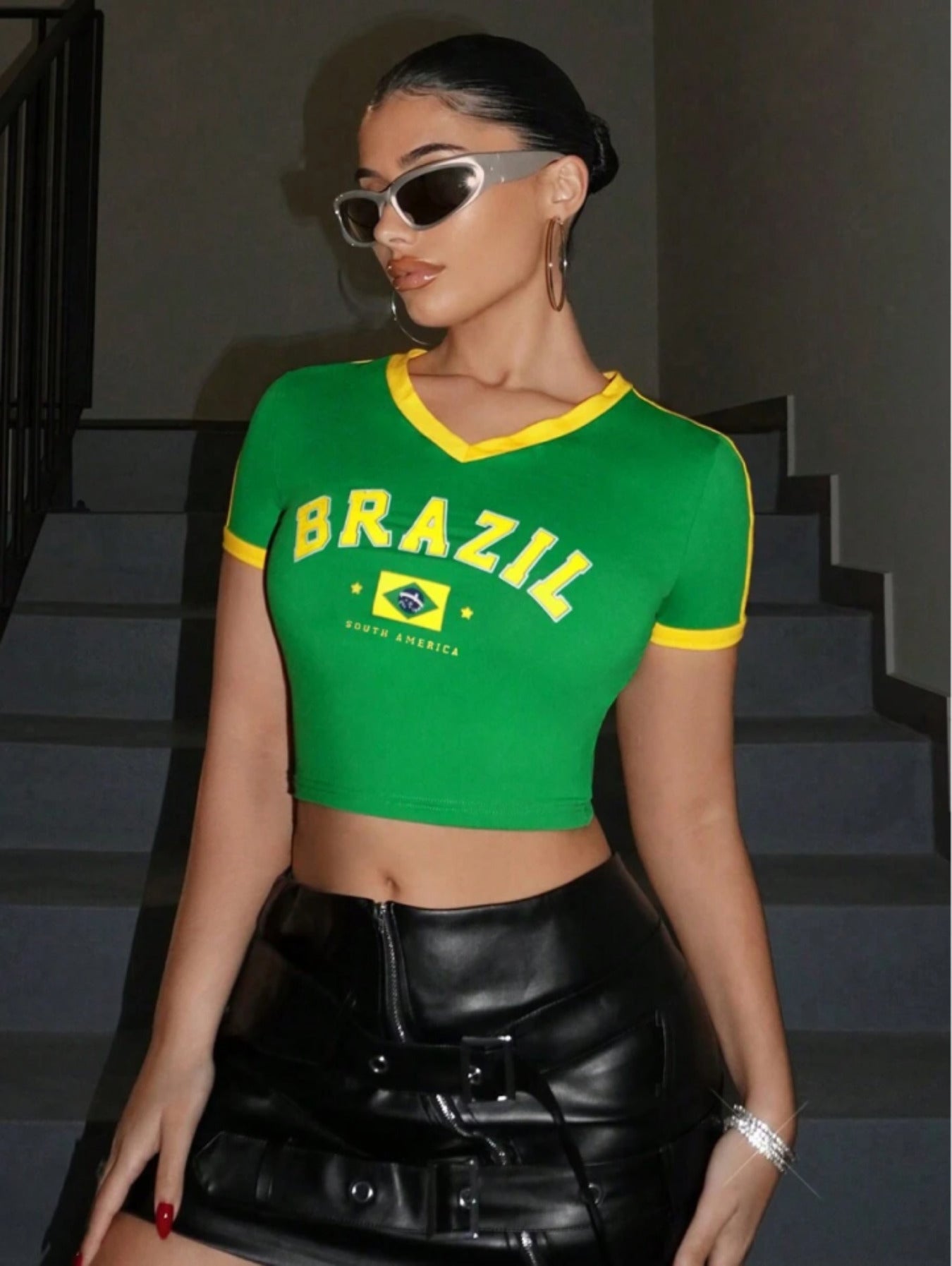 Green Brasil printed crop top with yellow ribbed trims, side stripes, flag graphic, and short sleeves