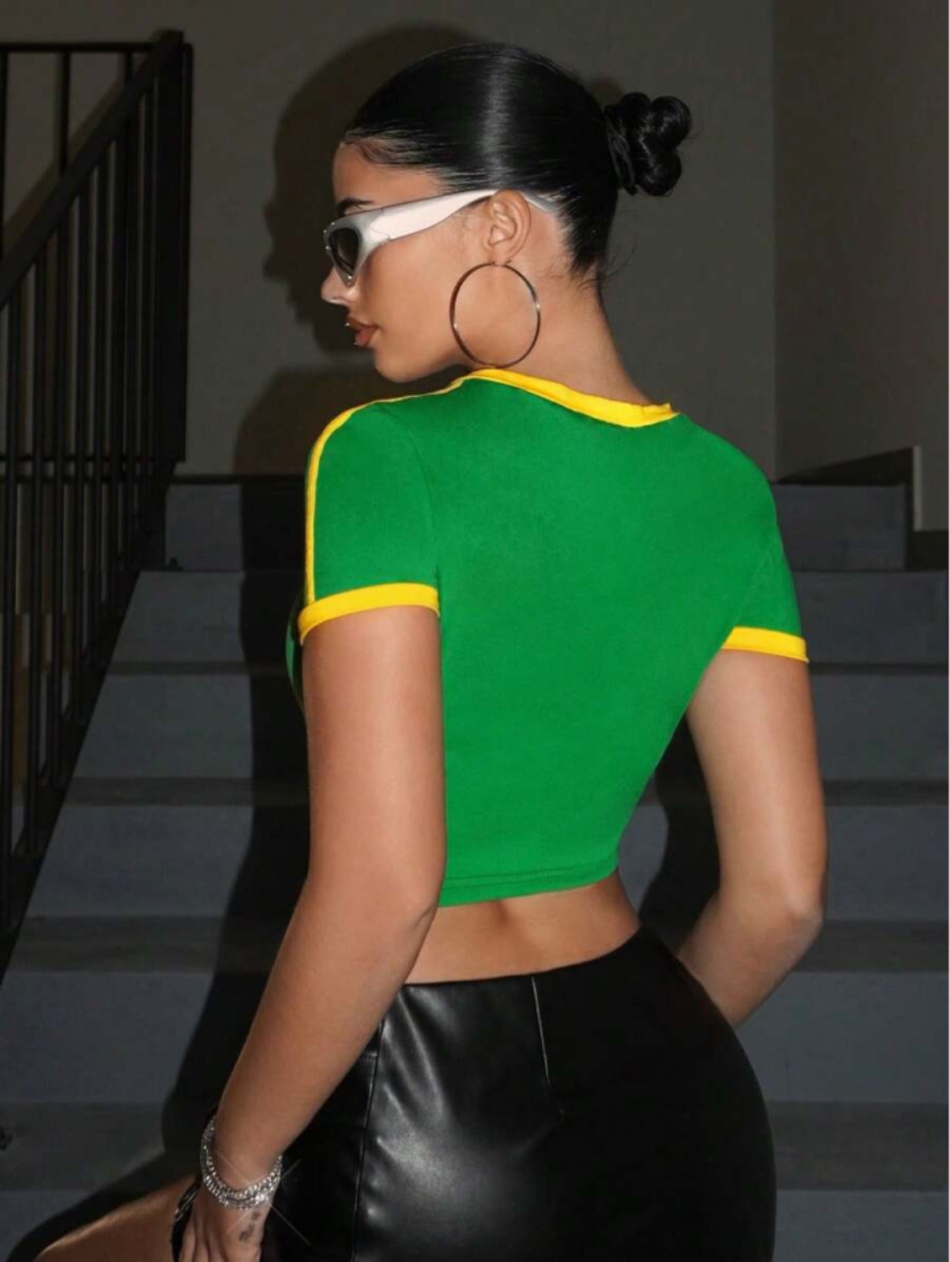 Green Brasil printed crop top with yellow ribbed trims, side stripes, flag graphic, and short sleeves