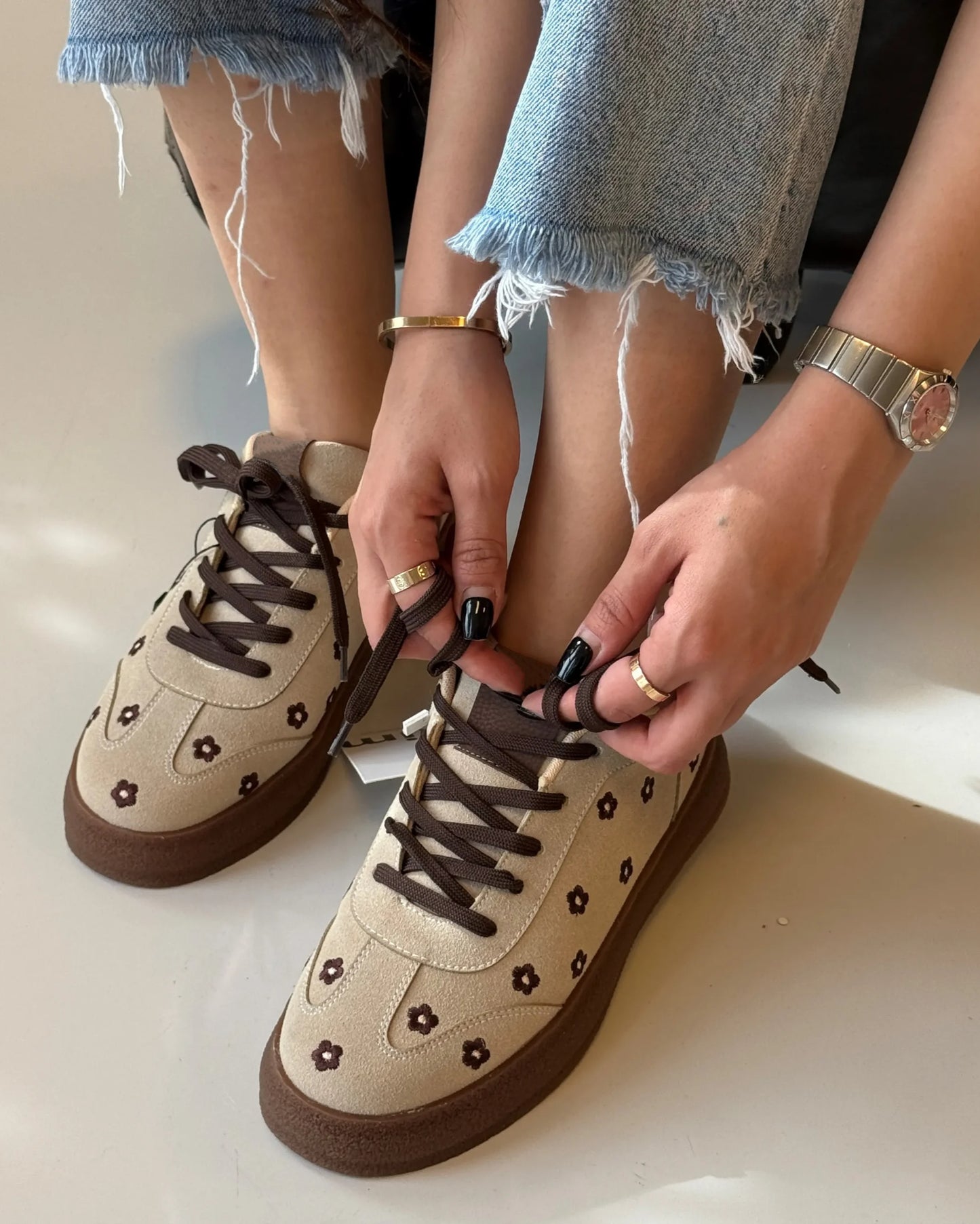 Cream suede sneakers for women with embroidered flowers, lace-up front and platform sole