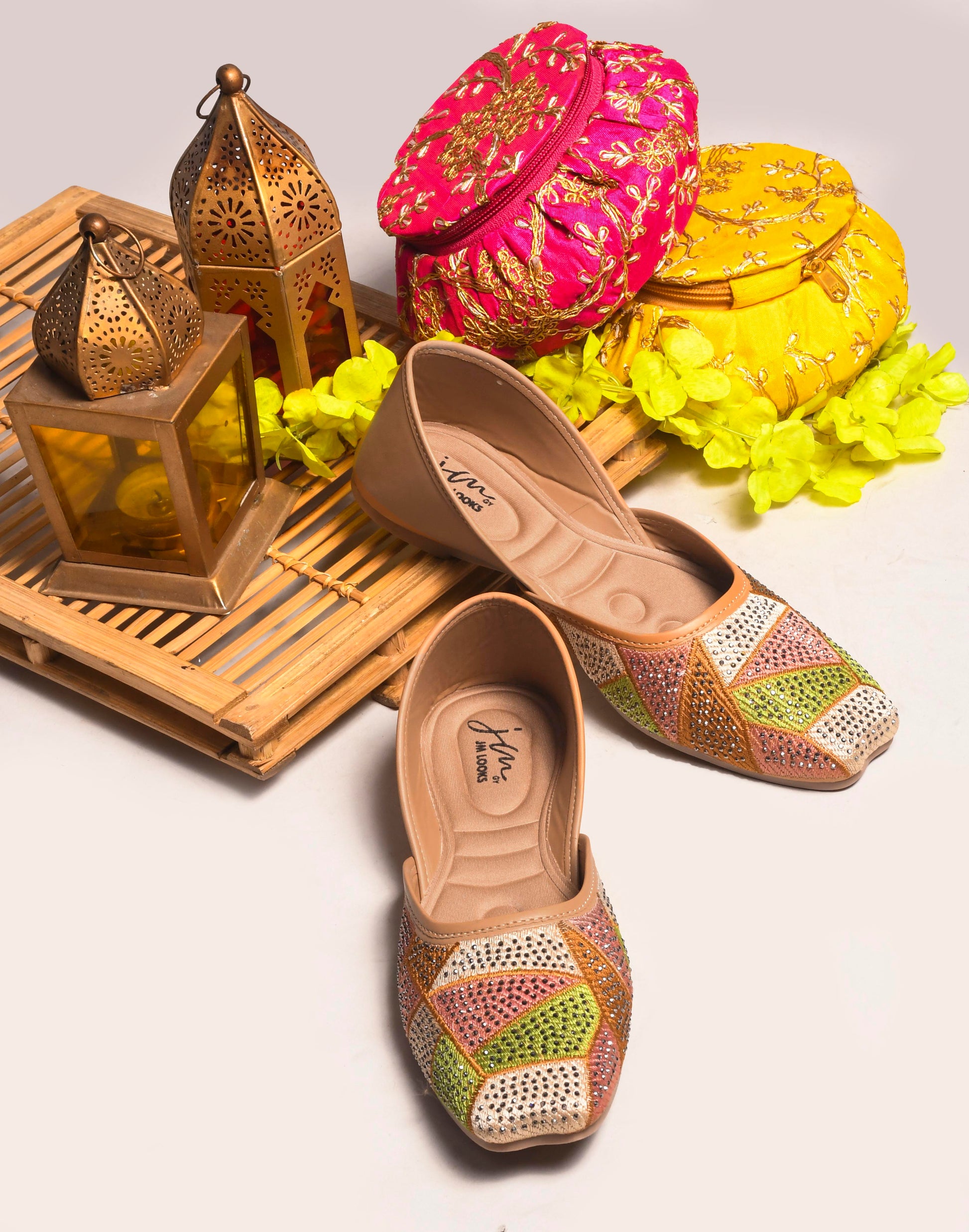 embellished juttis featuring a vibrant geometric pattern with sparkling details
 Beige
