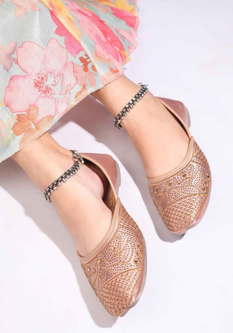 JM Looks women's juttis with intricate embellishments and a traditional design
 Beige