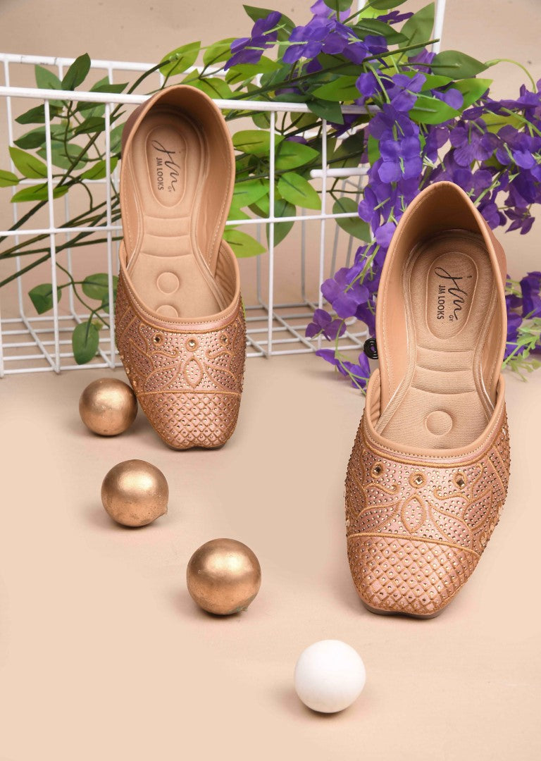 JM Looks women's juttis with intricate embellishments and a traditional design
 Beige