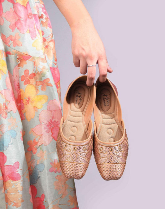 JM Looks women's juttis with intricate embellishments and a traditional design
 Beige
