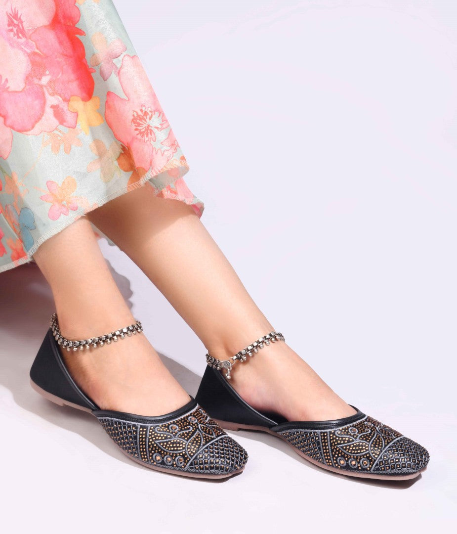 JM Looks women's juttis with intricate embellishments and a traditional design
 Black