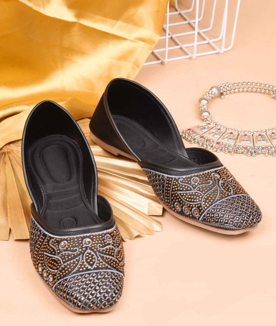 JM Looks women's juttis with intricate embellishments and a traditional design
 Black