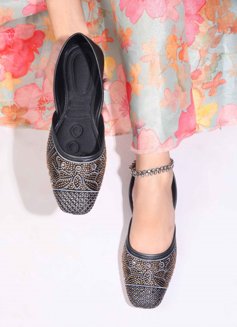 JM Looks women's juttis with intricate embellishments and a traditional design
 Black