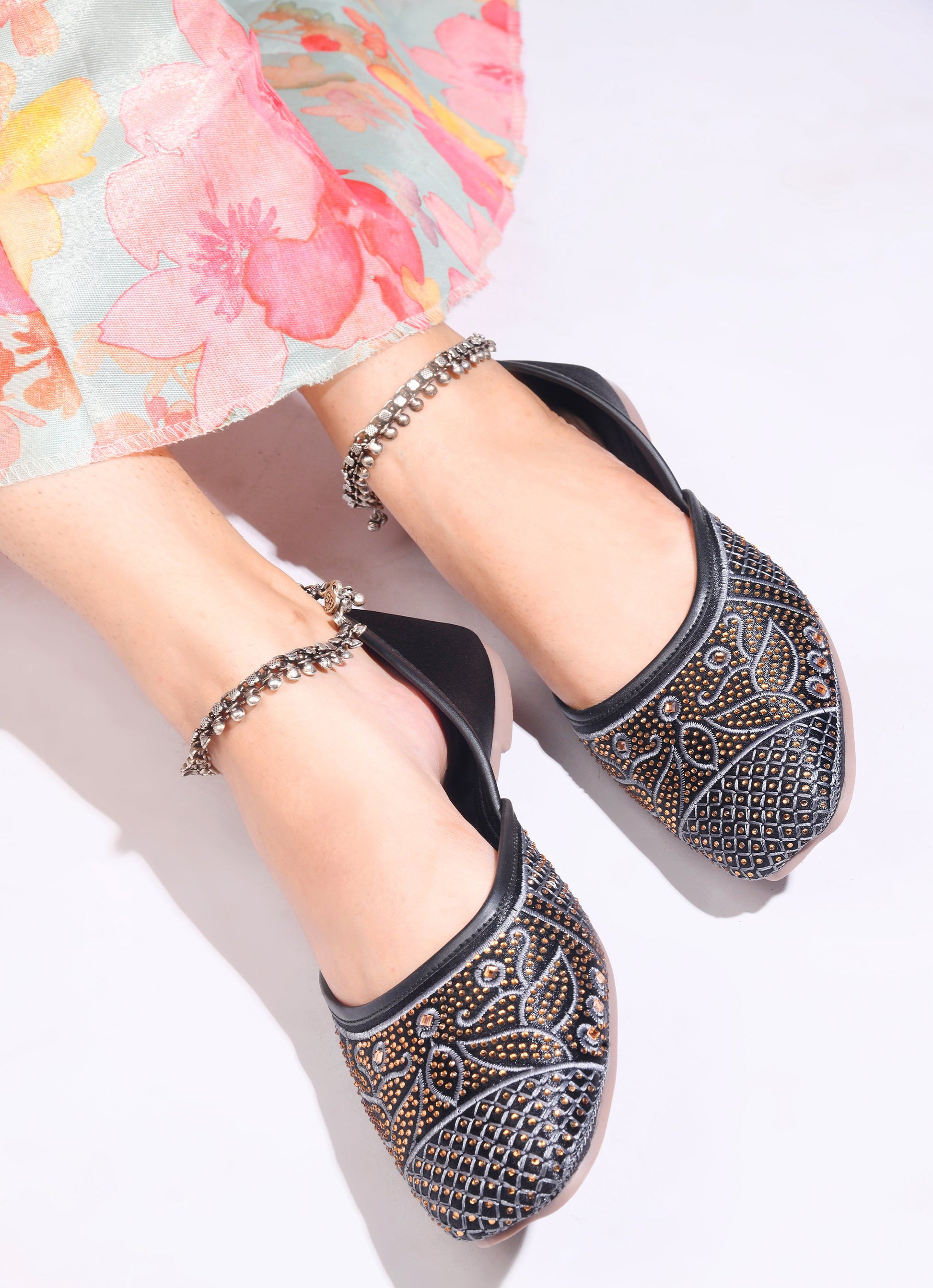 JM Looks women's juttis with intricate embellishments and a traditional design
 Black