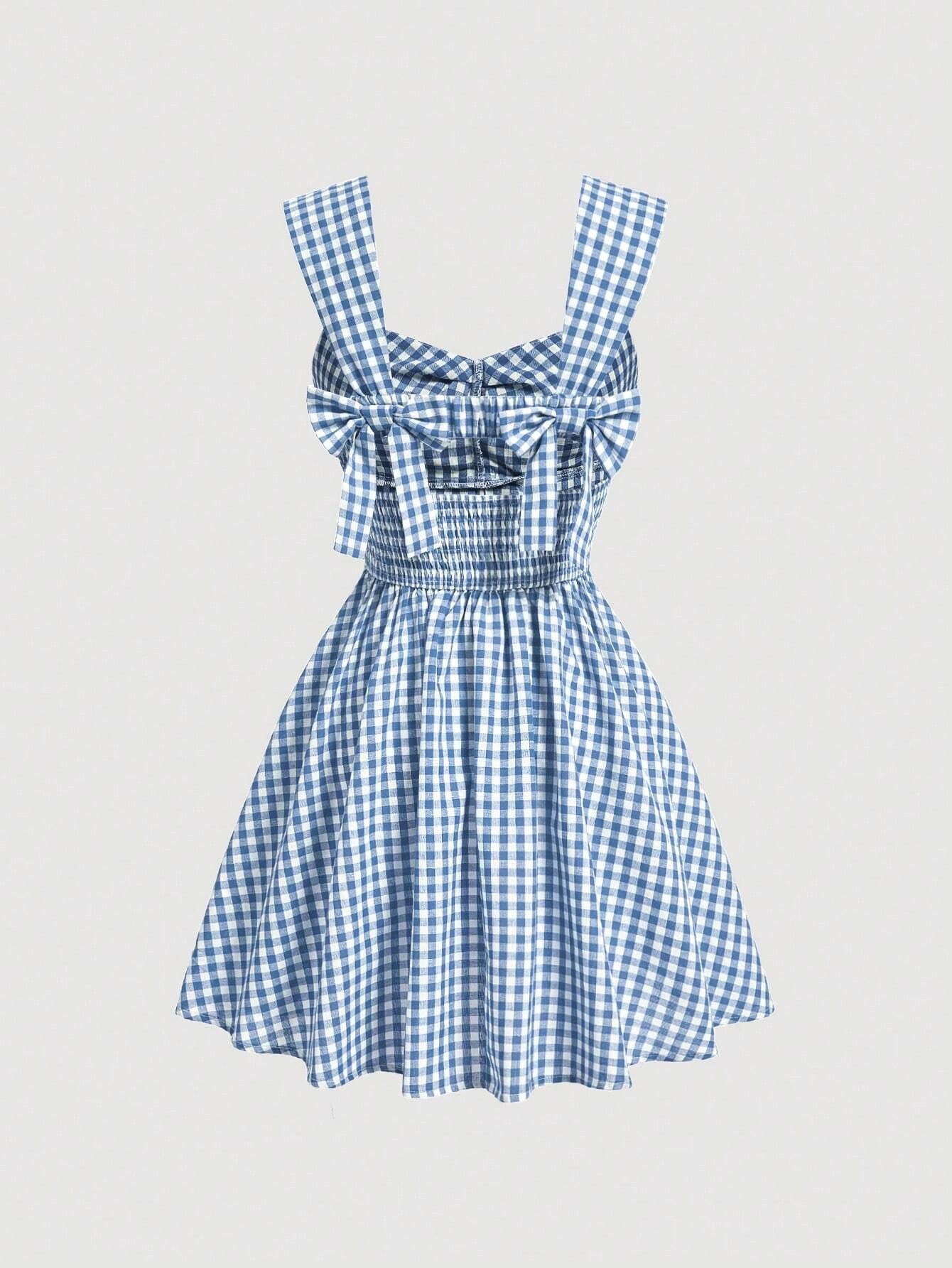 Blue gingham checked sleeveless dress with sweetheart neckline, wide straps, bow detail, and flared A-line silhouette