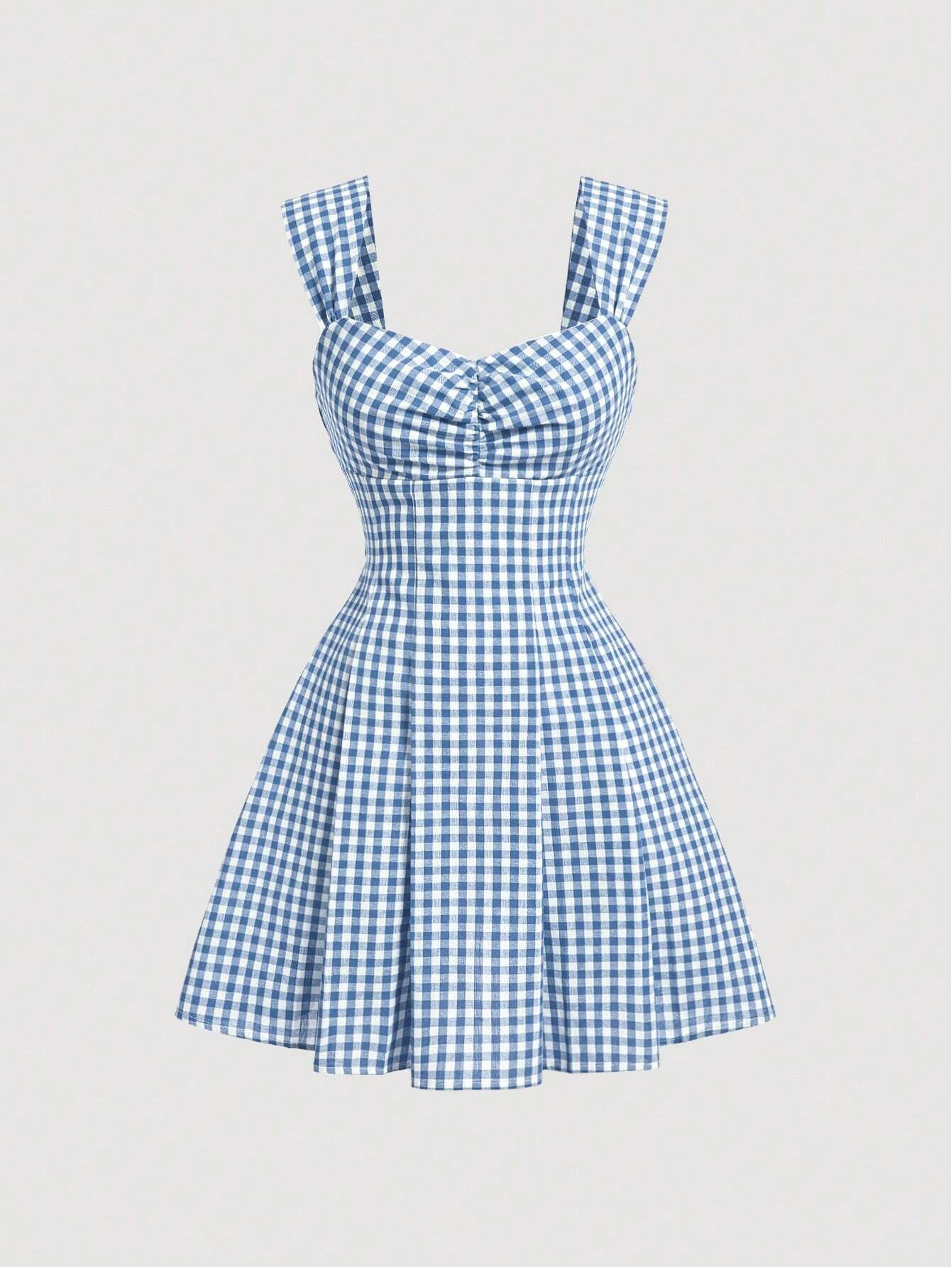 Blue gingham checked sleeveless dress with sweetheart neckline, wide straps, bow detail, and flared A-line silhouette