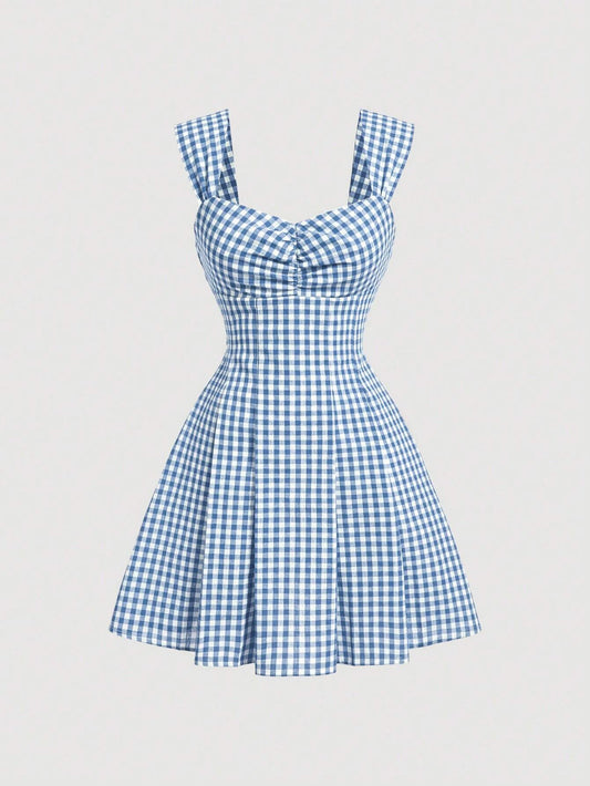 Blue gingham checked sleeveless dress with sweetheart neckline, wide straps, bow detail, and flared A-line silhouette