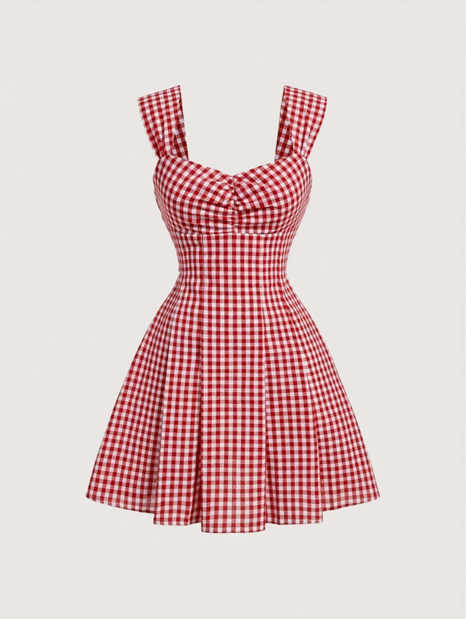 Red gingham sleeveless mini dress with bow detail, sweetheart neckline, wide straps, and flared A-line skirt