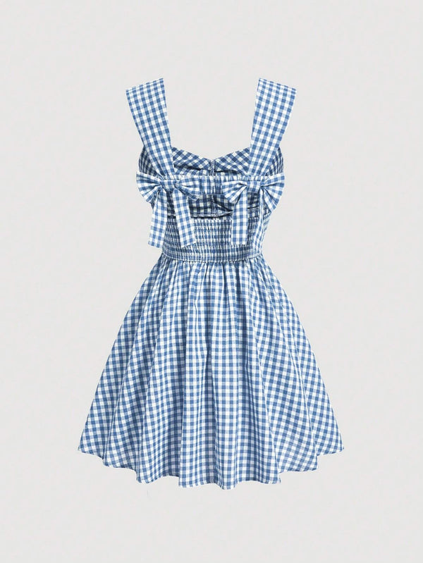 Blue gingham sleeveless mini dress with bow detail, sweetheart neckline, wide straps, and flared A-line skirt