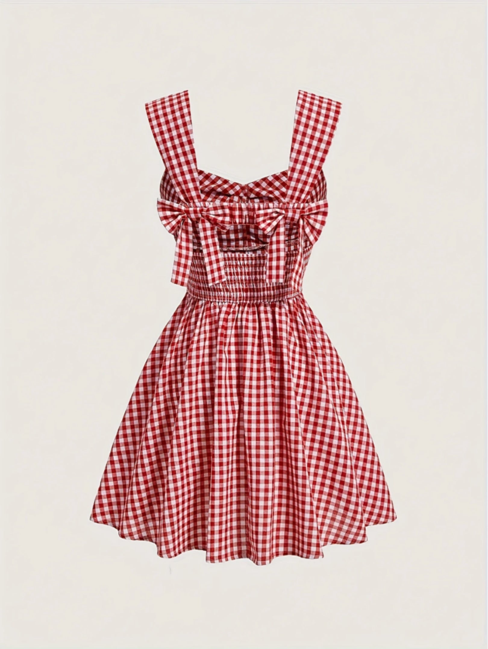 Red gingham sleeveless mini dress with bow detail, sweetheart neckline, wide straps, and flared A-line skirt