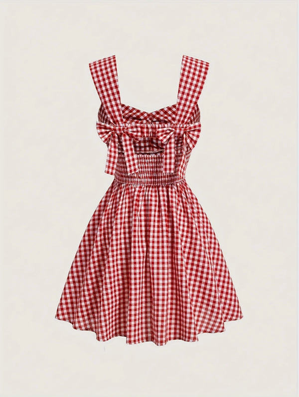 Red gingham sleeveless mini dress with bow detail, sweetheart neckline, wide straps, and flared A-line skirt