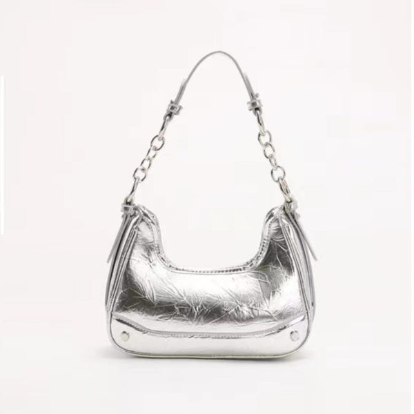 Sliver chain-strap shoulder bag featuring silver hardware, zip top closure, and trendy structured vegan leather design.