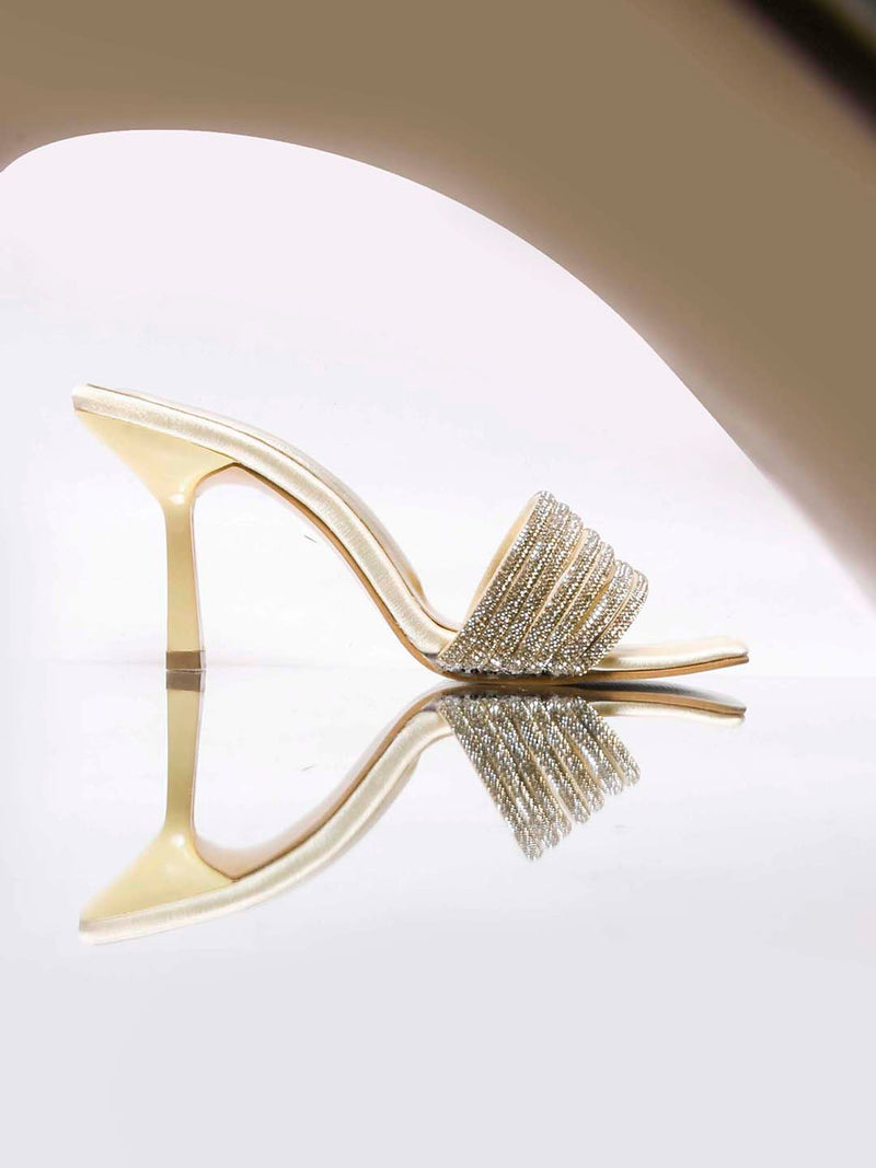 pen-toe high-heeled mules with an embellished wide strap and a contemporary square toe
 Gold