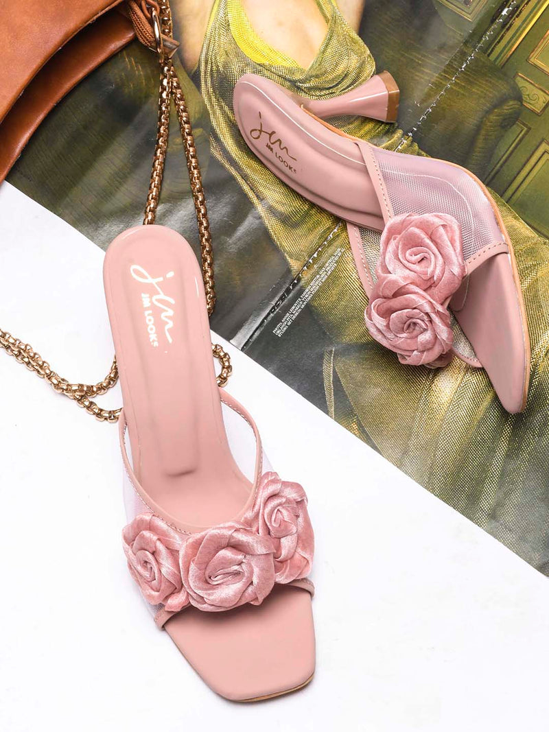 JM Looks heeled mules featuring two prominent floral appliques on the vamp strap and a flared heel
 Peach