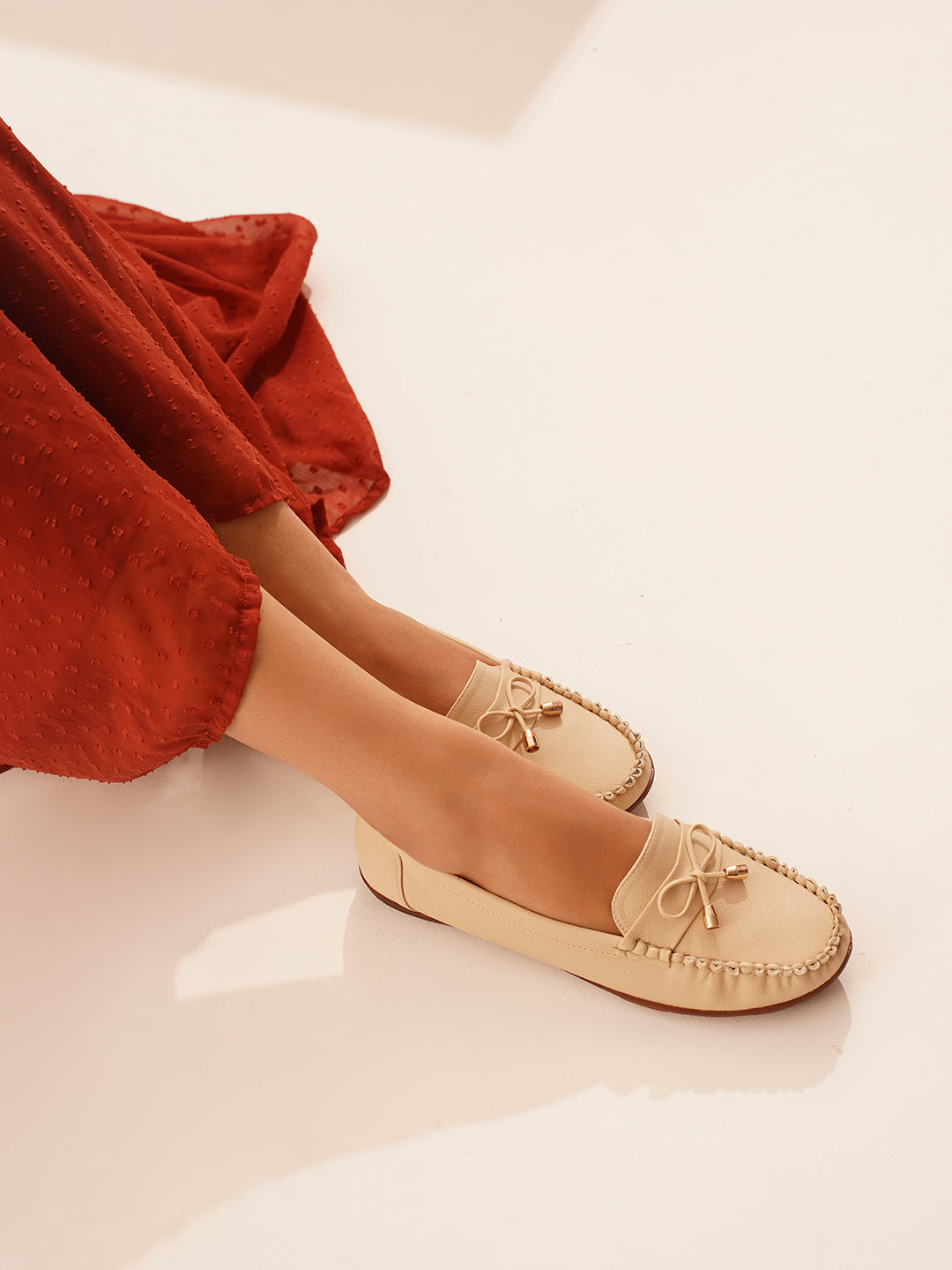 JM Looks women's driving loafers with a bow detail and stitched moc toe
 Cream