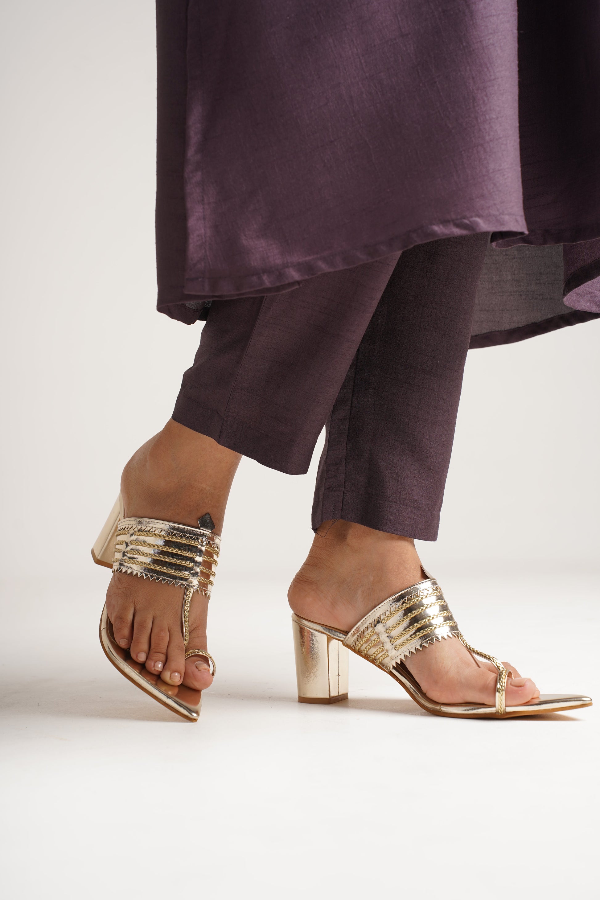 classic toe-ring block heels with a structured upper design
 Gold