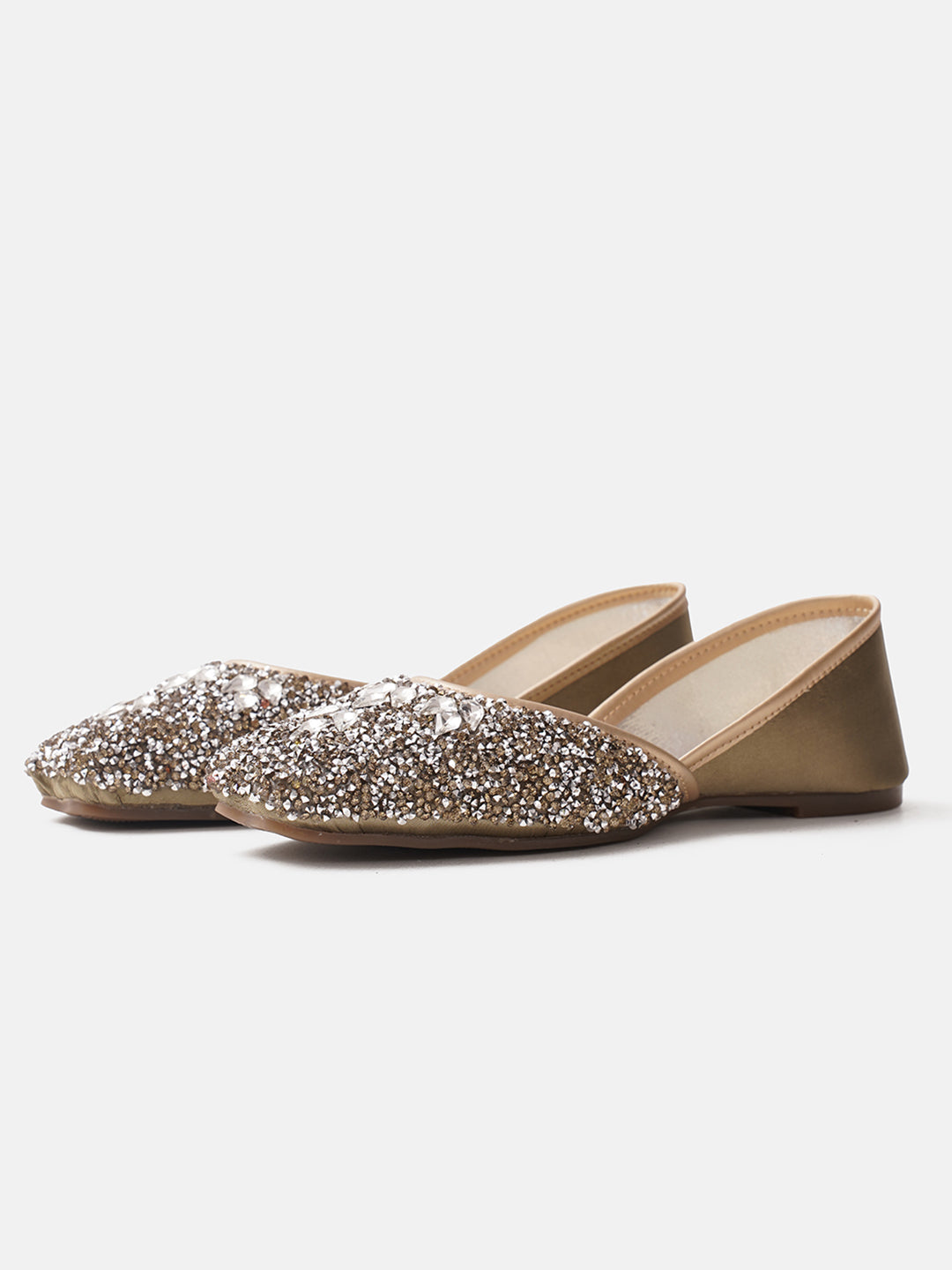 traditional juttis heavily embellished with sequins and large stone details in a floral pattern at the toe
 Green