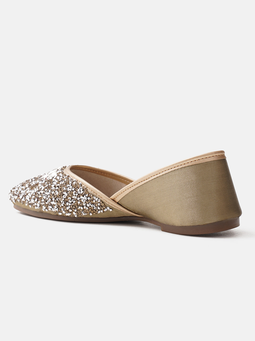 traditional juttis heavily embellished with sequins and large stone details in a floral pattern at the toe
 Green