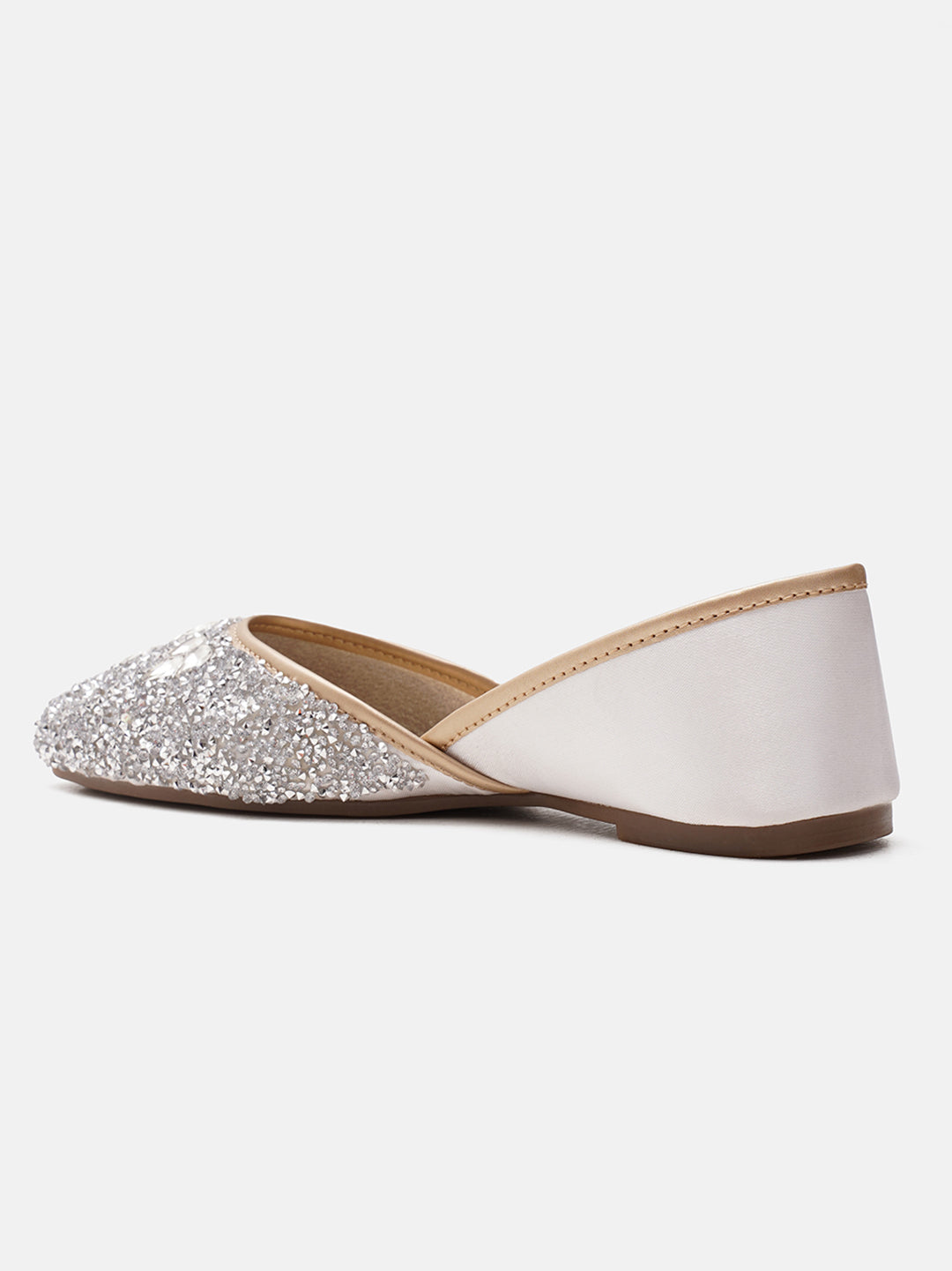 traditional juttis heavily embellished with sequins and large stone details in a floral pattern at the toe
 White